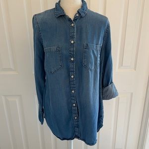 Denim buttoned down shirt by Merona. Worn a few times. Longer in the back.